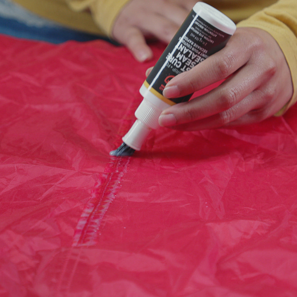 Gear Aid Seam Grip FC Fast Cure Seam Sealant shown in use