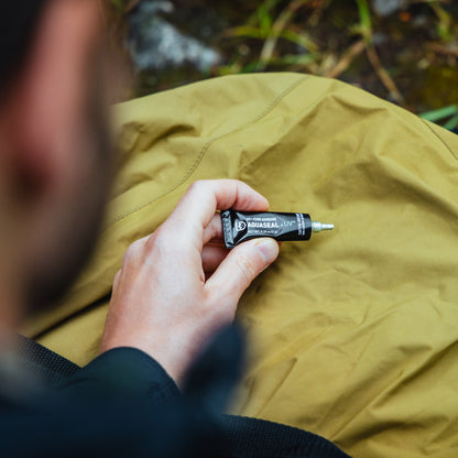 Gear Aid Aquaseal UV Field Repair Adhesive shown in use