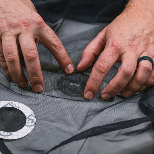 Gear Aid Tenacious Tape Mesh Patches shown in use
