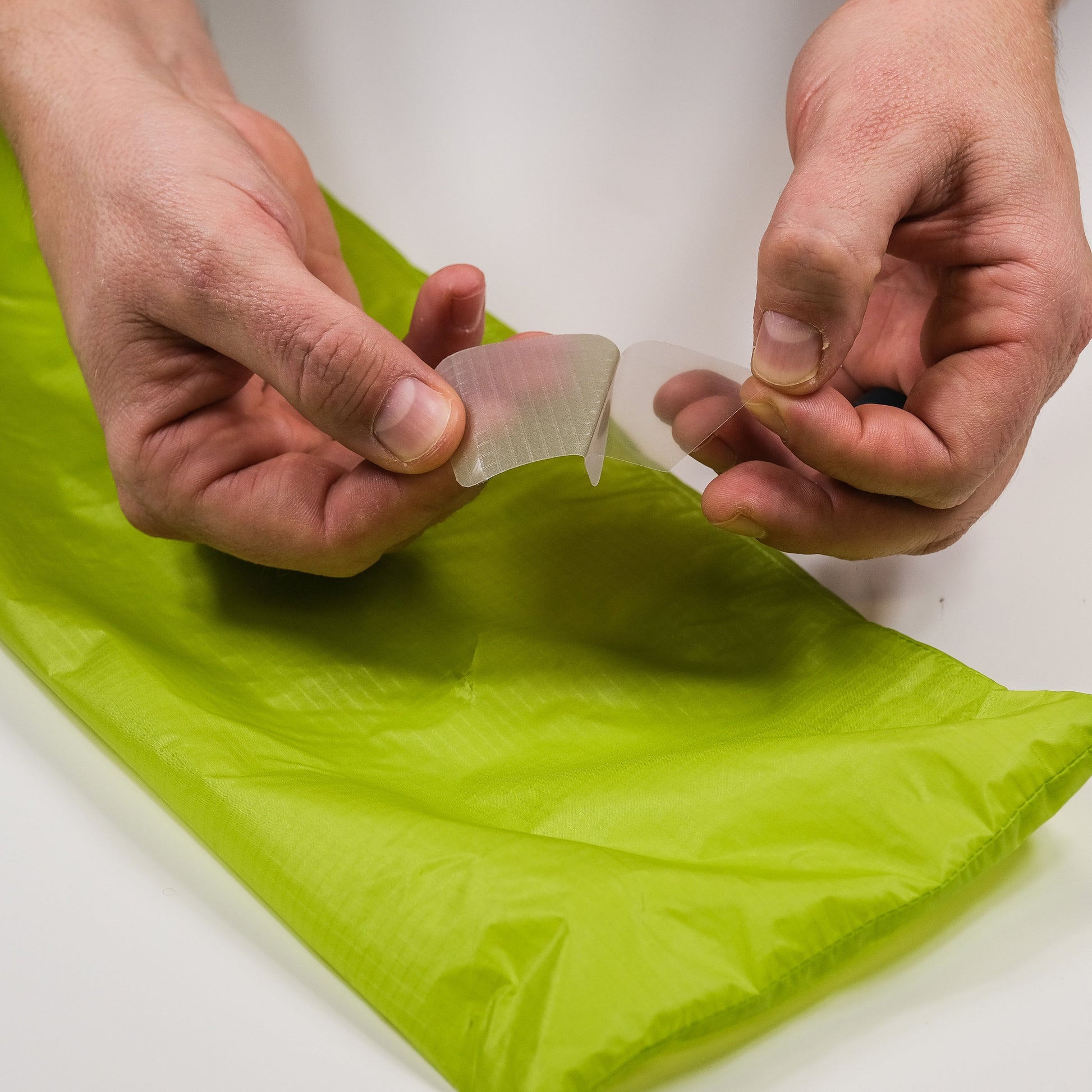 Gear Aid Tenacious Tape Silnylon Patches shown in use