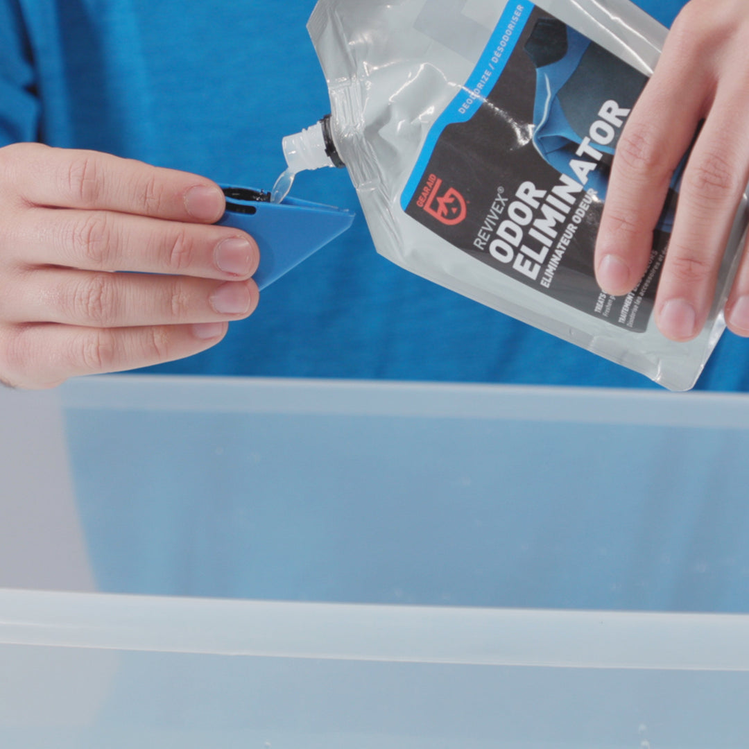 Gear Aid Revivex Odor Eliminator shown in use