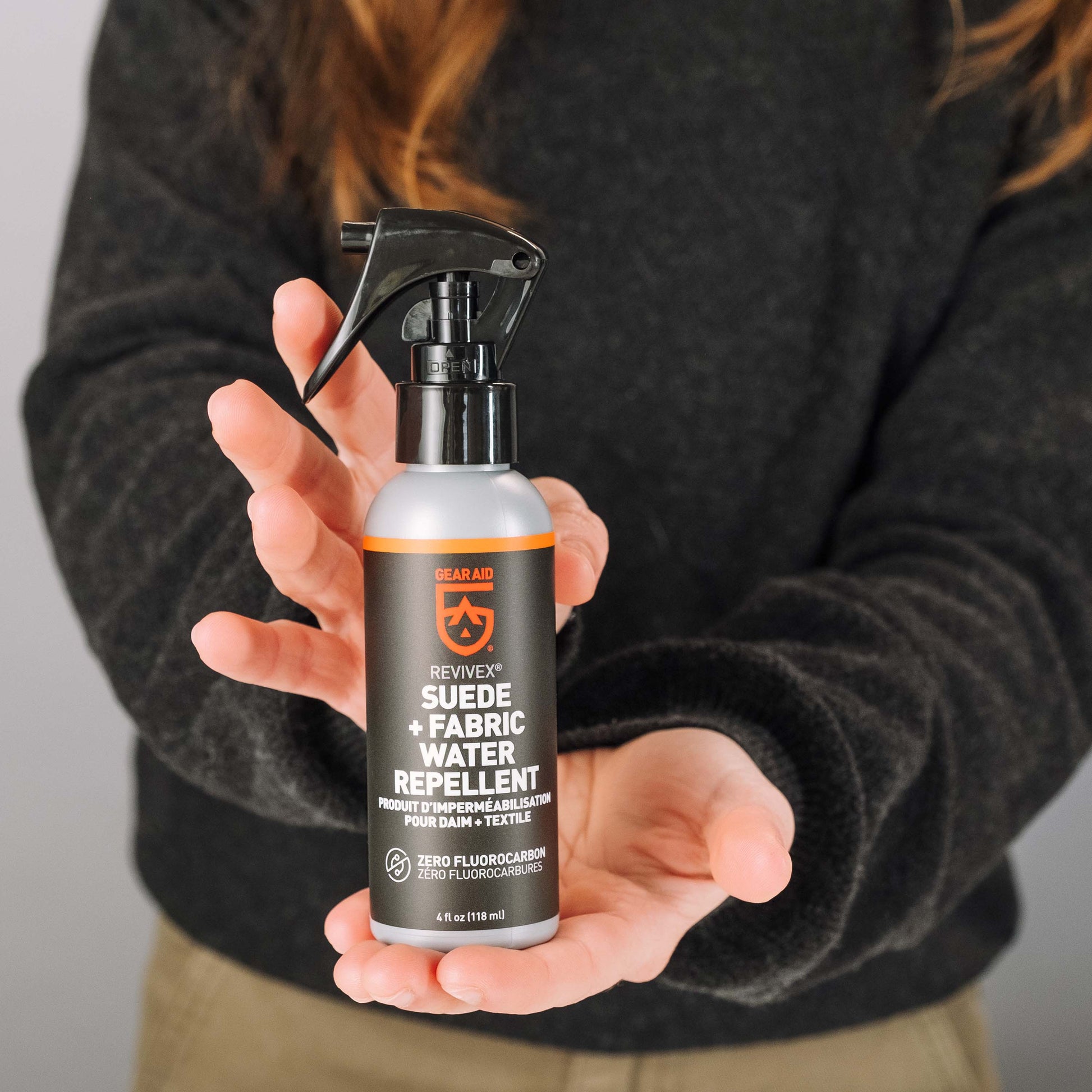 Gear Aid Revivex Suede and Fabric Water Repellent shown in use