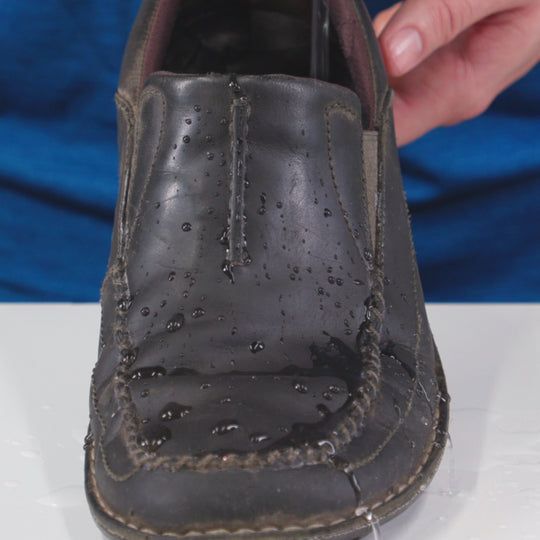 Gear Aid Revivex Leather Water Repellent shown in use