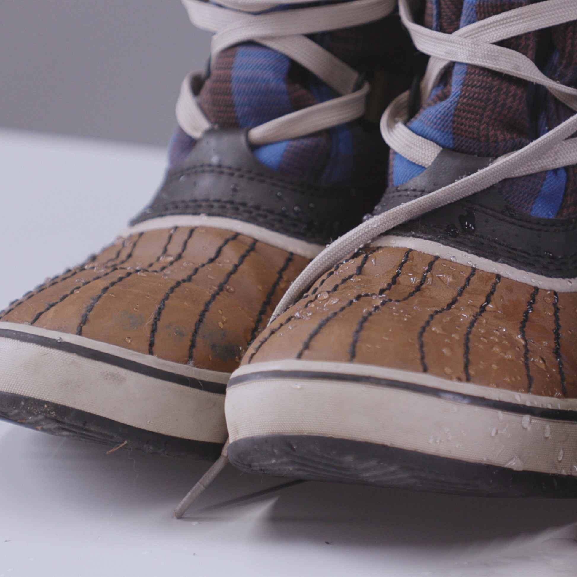 Gear Aid Revivex Suede and Fabric Water Repellent shown in use