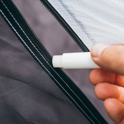 Gear Aid Zipper Lubricant Stick shown in use