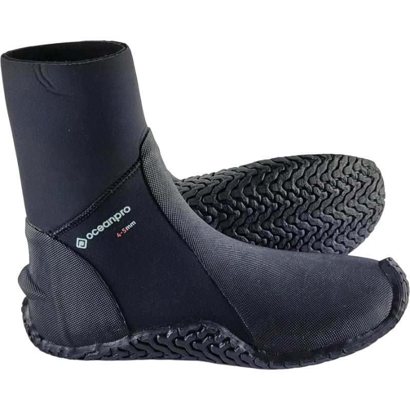 Pair of black Oceanpro Ultra Stretch 5/4mm zipless boots, with one boot turned to show the non-slip treaded sole.