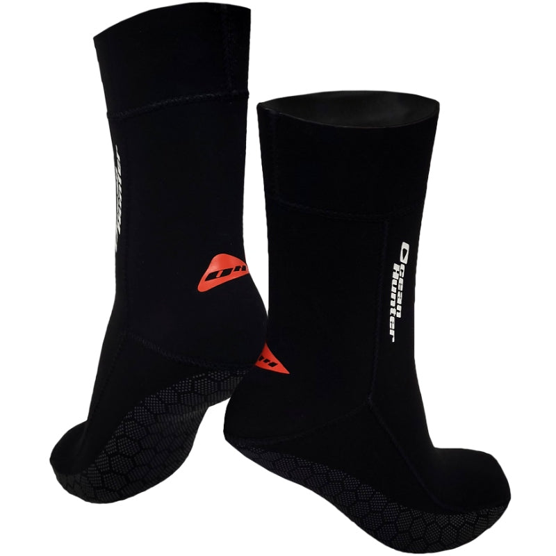 Front and rear views of Ocean Hunter Ultra Stretch Socks with red heel logos and patterned soles.