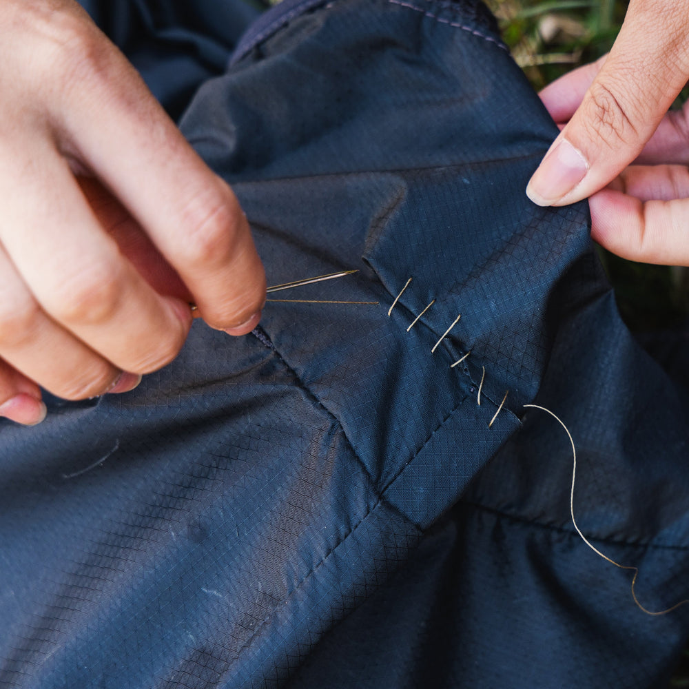Gear Aid Sewing Kit shown in use