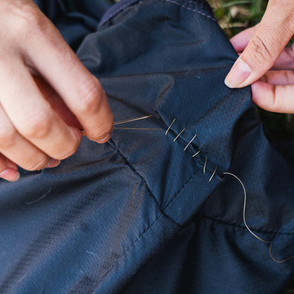 Gear Aid Sewing Kit shown in use