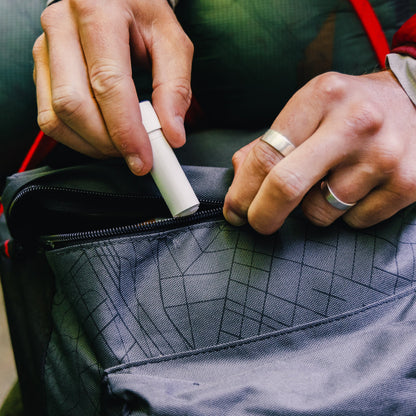 Gear Aid Zipper Lubricant Stick shown in use