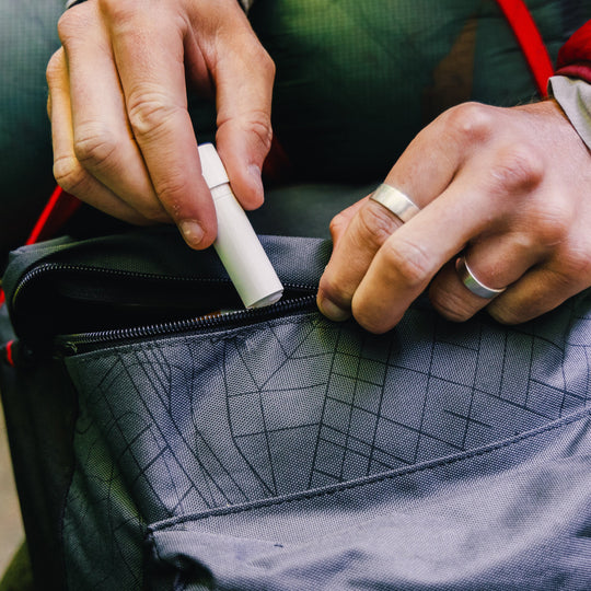 Gear Aid Zipper Lubricant Stick shown in use
