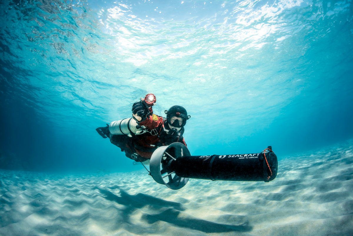 Diver travelling underwater with a Seacraft FUTURE diver propulsion vehicle