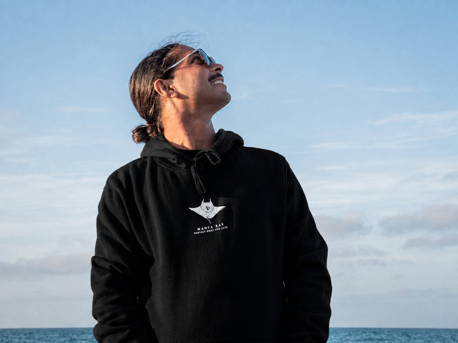 Protect What You Love Manta Ray Hoodie — Black, worn front view
