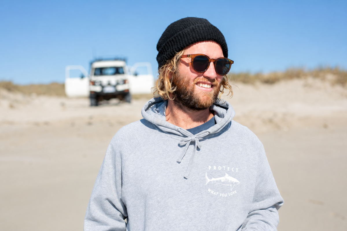 Protect What You Love Classic Tiger Shark Hoodie — Grey with white print, worn front view