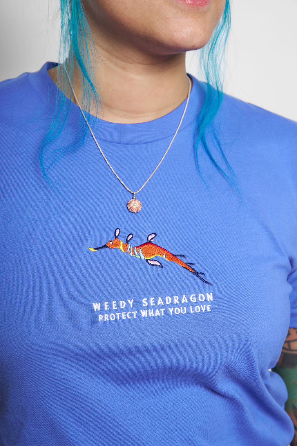 Protect What You Love Weedy Seadragon Tee — Winter Blue, worn front detail