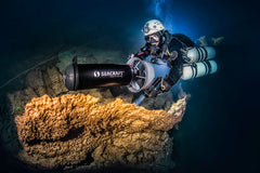Diver using a Seacraft GHOST DPV underwater